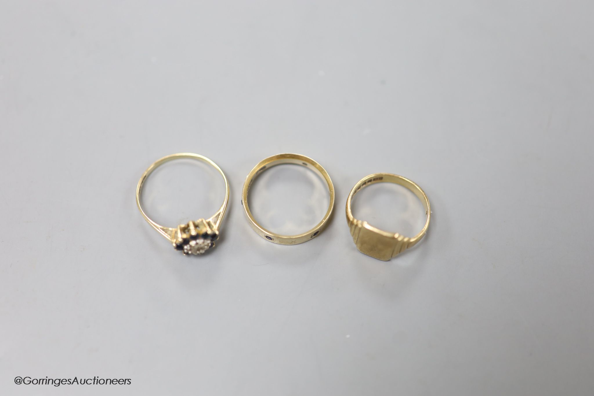 Three assorted modern 9ct gold rings including signet and gem set